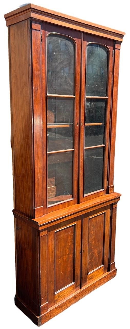 AN EARLY 19TH CENTURY MAHOGANY GLAZED BOOKCASE With shelf interior above a pair of panelled doors - Image 2 of 3