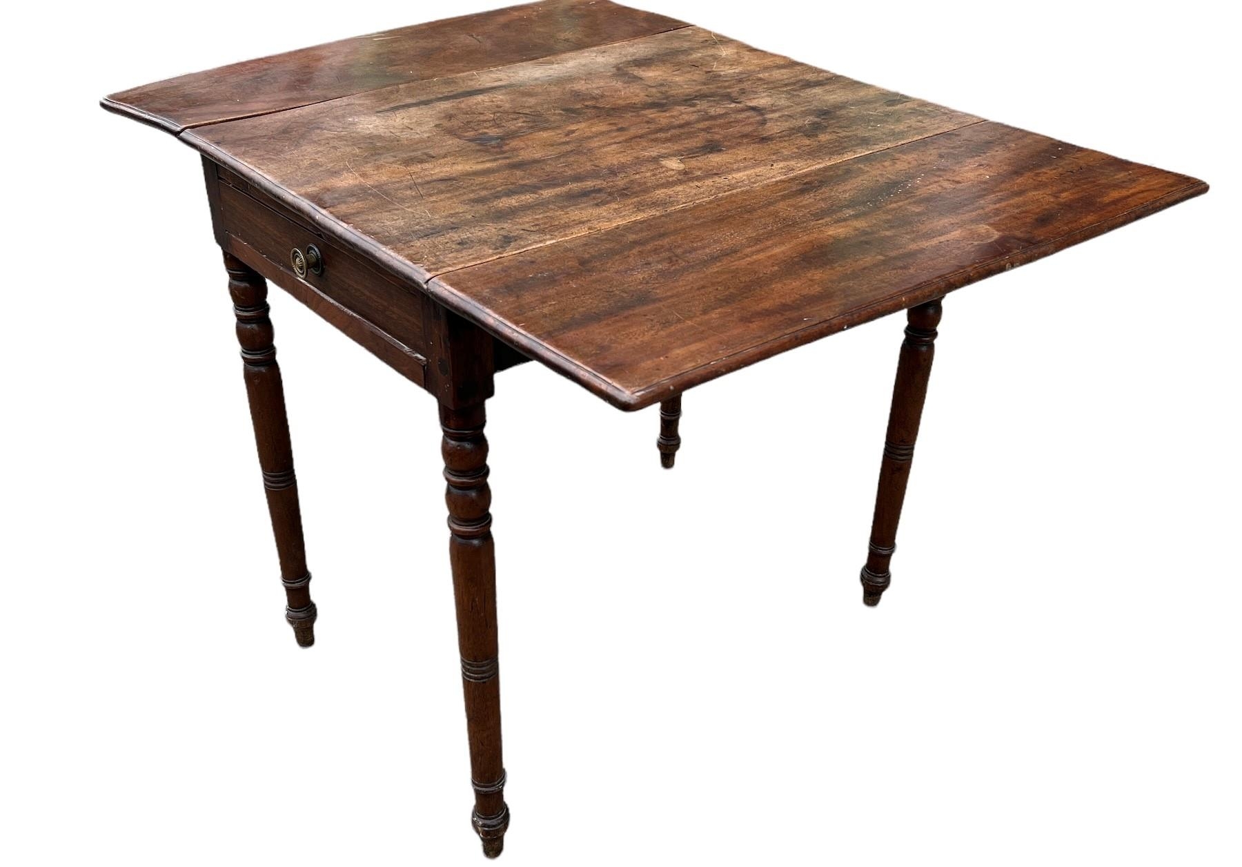 A 19TH CENTURY SOLID MAHOGANY PEMBROKE TABLE With a single drawer, raised on turned legs. (h 72cm - Image 2 of 2