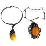 A LARGE SILVER AND BUTTERSCOTCH AMBER CHOKER NECKLACE Together with a white metal and amber