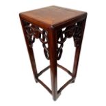 A SMALL CHINESE HARDWOOD TABLE STAND The square top above a pieced frieze, raised on square