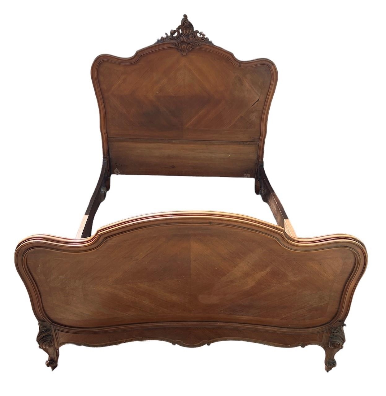 A 19TH CENTURY FRENCH LOUIS XVI DESIGN CARVED WALNUT DOUBLE BED. (h 149cm x w 147cm x length 203cm)