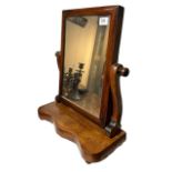 A 19TH CENTURY VICTORIAN MAHOGANY FRAMED DRESSING TABLE MIRROR With scrolling support, raised on a
