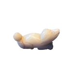 A CHINESE QING DYNASTY (OR LATER) WHITE JADE CARVING OF A DOG White ‘mutton fat’ colour, in a