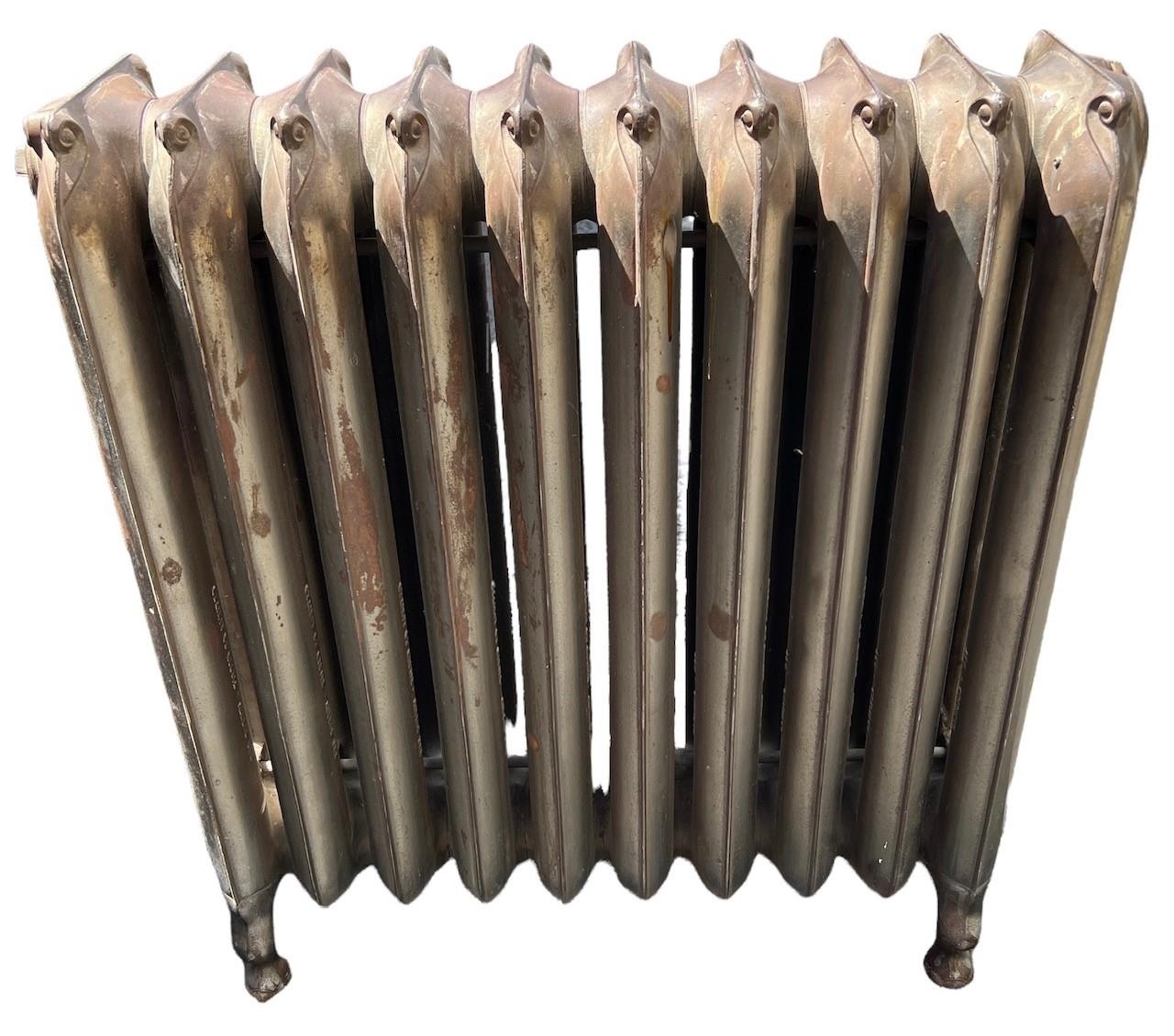 A LARGE FLOORSTANDING TEN BAR ART NOUVEAU CAST IRON RADIATOR Decorated with stylised