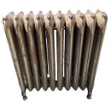 A LARGE FLOORSTANDING TEN BAR ART NOUVEAU CAST IRON RADIATOR Decorated with stylised