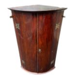 A 19TH CENTURY MAHOGANY BOW FRONTED CORNER CABINET With brass fittings, opening to reveal a