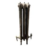 A LARGE FLOORSTANDING THREE BAR ART NOUVEAU CAST IRON RADIATOR Decorated with stylised scrolling