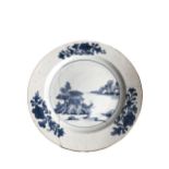 A CHINESE QING DYNASTY YONGZHENG BLUE AND WHITE PLATE Having dark brown rim, depicting a partial