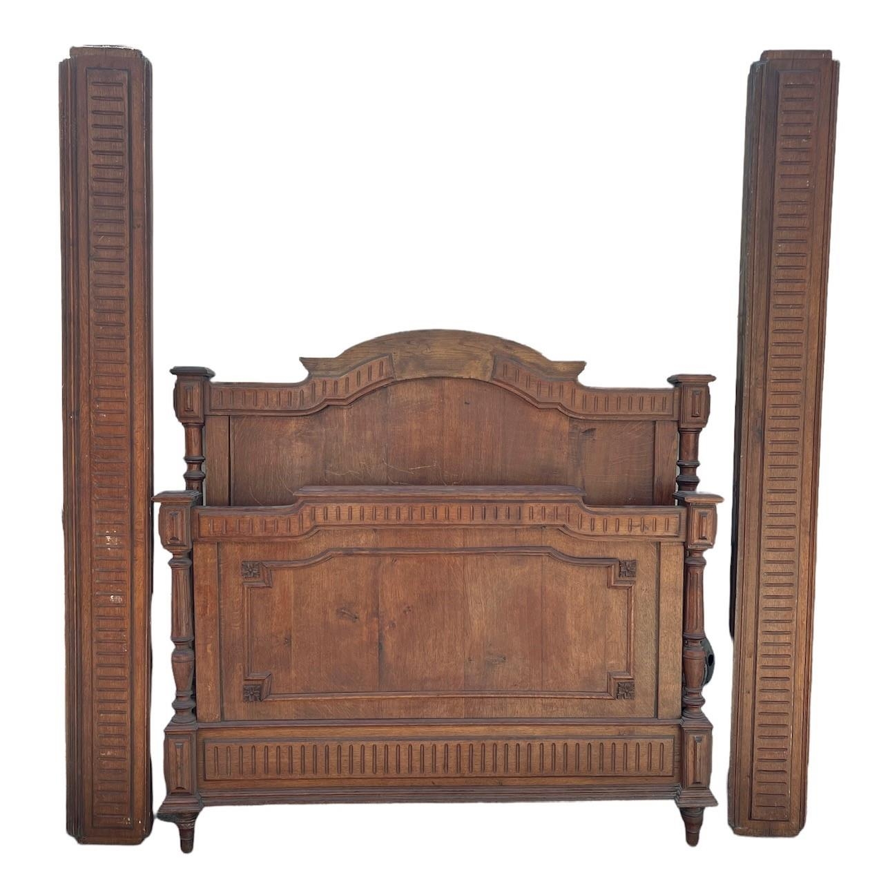 A 19TH CENTURY FRENCH CARVED OAK DOUBLE BED. (h 131cm x w 141cm x length 216cm)