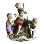 MEISSEN, ‘THE AUTUMN’, A 19TH CENTURY FIGURAL GROUP, FOUR PUTTI SEATED ON A RECUMBENT GOAT