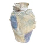 A LARGE DECORATIVE ASIAN POTTERY FACIAL MASK VASE WITH LIZARD HEADDRESS. (H 46cm x W 35cm x D 23cm)