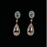 A PAIR OF 18CT ROSE AND WHITE GOLD DROP EARRINGS set with pear shaped morganite, oval aquamarine and