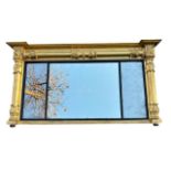 A LARGE 19TH CENTURY REGENCY CARVED GILTWOOD OVERMANTLE MIRROR The triple mercury plate glass