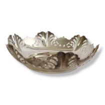 AN EARLY 20TH CENTURY SILVER SWEETMEAT DISH Having a scrolled edge with pierced design, hallmarked