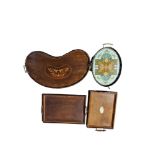 AN EDWARDIAN MAHOGANY INLAID KIDNEY SHAPED TWIN HANDLED GALLERY TRAY Together with two oak