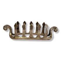 AN EARLY 20TH CENTURY SILVER 'VIKING SHIP' TOASTRACK Having scrolled ends and cruciform dividers,