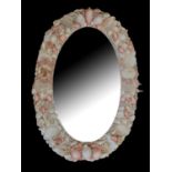 A 20TH CENTURY ORNAMENTAL LADIES’ OVAL SEASHELL AND CORAL WALL MIRROR Set with various exotic