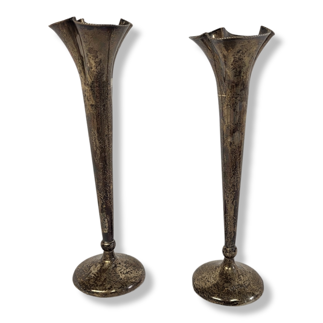 A PAIR OF EDWARDIAN SILVER TRUMPET VASES Having a flared top and circular base, hallmarked