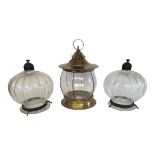 A PAIR OF EARLY 20TH CENTURY GLASS FLUTED CIRCULAR HANGING LANTERNS With metallic mounts, together