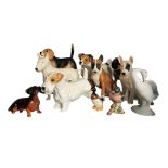 A COLLECTION OF EIGHT VARIOUS MODELS OF DOGS Consisting of Royal Doulton model of a Terrier (