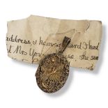 A VICTORIAN SILVER GILT FILIGREE LOCKET Having floral decoration and pierced scrolled work. (