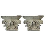 A PAIR OF EARLY 20TH CENTURY RECONSTRUCTED STONE CORINTHIAN CAPITALS Plain back. (h 21cm x w 36cm)
