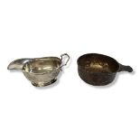 AN EARLY 20TH CENTURY SILVER PORRINGER AND SAUCEBOAT Circular form, with single handle and