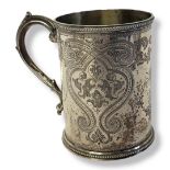 A VICTORIAN SILVER CHRISTENING MUG Having engraved scrolled decoration and central cartouche,