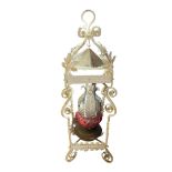 A LARGE EARLY 20TH CENTURY PAINTED WROUGHT IRON FLOOR STANDING OIL LANTERN With a cranberry glass