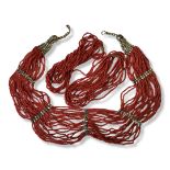 A COLLECTION OF THREE VINTAGE CONTINENTAL WHITE METAL AND RED CORAL NECKLACES To include a multi