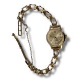 ROTARY, INCABLOC, A VINTAGE 9CT GOLD LADIES’ WRISTWATCH Silver tone dial, on a pierced 9ct gold