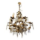 AN EARLY 20TH CENTURY CONTINENTAL BRASS AND CUT GLASS CHANDELIER Having six branch arms, organic