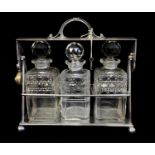 AN EARLY 20TH CENTURY CASED SHEFFIELD SILVER PLATED THREE SECTION TANTALUS Shape design inspired