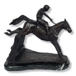 A BRONZE RACEHORSE AND JOCKEY SCULPTURE On a marble base depicting a hedge jumping. (h 33cm x length