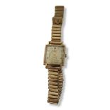 EVERITE, AN EARLY 20TH CENTURY 9CT GOLD GENT’S WRISTWATCH The square silver tone dial with gilt