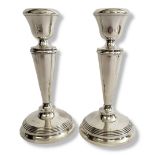 A PAIR OF MID 20TH CENTURY ART DECO STYLE STERLING HALLMARKED SILVER TABLE CANDLESTICKS With knopped