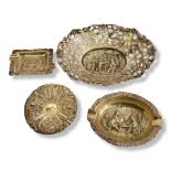 A COLLECTION OF CONTINENTAL WHITE METAL TRINKETS Comprising a pierced bonbon dish with embossed