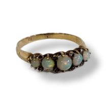 AN EARLY 20TH CENTURY 18CT GOLD, OPAL AND DIAMOND FIVE STONE RING The row of cabochon cut stones