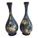 DOULTON LAMBETH, A PAIR OF 19TH CENTURY AESTHETIC MOVEMENT FAIENCE VASES, CIRCA 1879 Enamelled in