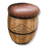 A LEATHER TOPPED WOODEN HENDRICKS BARREL STOOL Hendricks Gin logo printed on the barrel. (h 54cm)