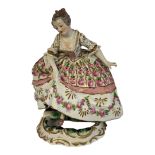 A LATE 19TH CENTURY CONTINENTAL SEVRES STYLE HARD PASTE PORCELAIN FIGURE, A LADY IN 18TH CENTURY