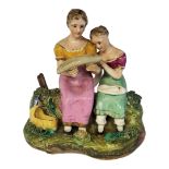 AN EARLY 19TH CENTURY STAFFORDSHIRE PORCELAIN GROUP, MOTHER AND CHILD, CIRCA 1800 - 1830 Painted