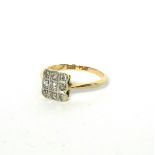 AN ART DECO 18CT GOLD NINE STONE DIAMOND RING The arrangement of round cut stones in a platinum