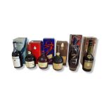 COURVOISIER, A COLLECTION OF THREE VINTAGE BOTTLES Along with three Martell Cognac bottles,