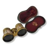 A PAIR OF VICTORIAN GILT BRASS AND MOTHER PEARL OPERA GLASSES Having telescopic lenses marked H.