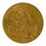 AN EARLY 20TH CENTURY 22CT GOLD SOVEREIGN COIN, DATED 1911 With King George V bust and George and