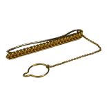 AN EARLY 20TH CENTURY YELLOW METAL GENTS TIE PIN Herringbone rope design and white metal pin. (