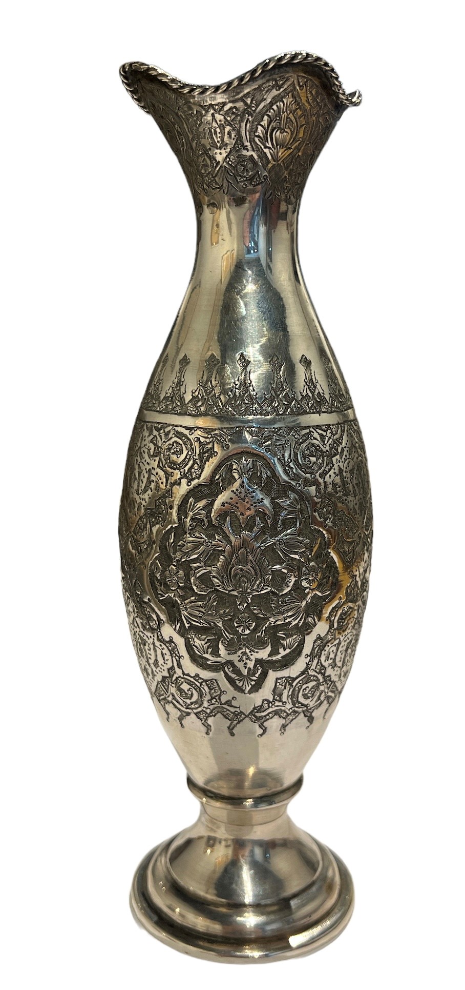 A 20TH CENTURY PERSIAN/IRANIAN SILVER VASE Having four floral chased relief panels surrounded by