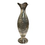 A 20TH CENTURY PERSIAN/IRANIAN SILVER VASE Having four floral chased relief panels surrounded by