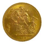 AN EARLY 20TH CENTURY 22ct GOLD SOVEREIGN COIN, DATED 1912 With King George V bust and George and